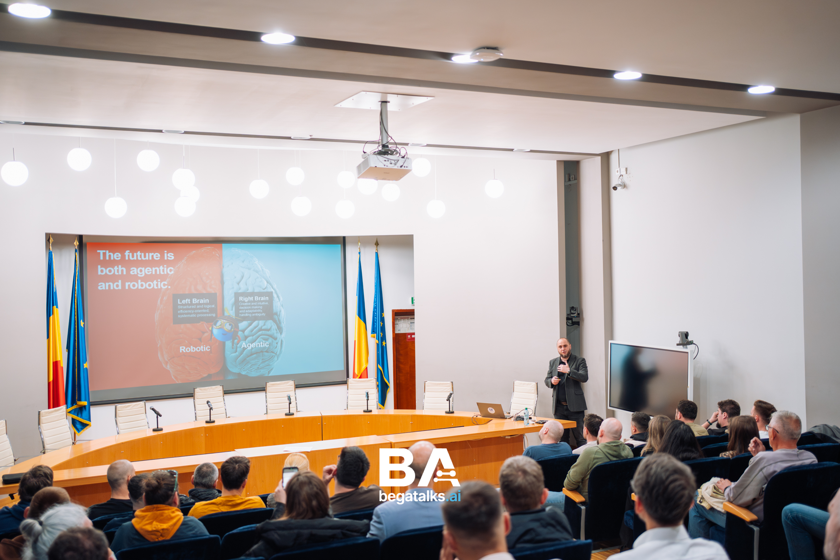 Andrei Oros on stage during the talk